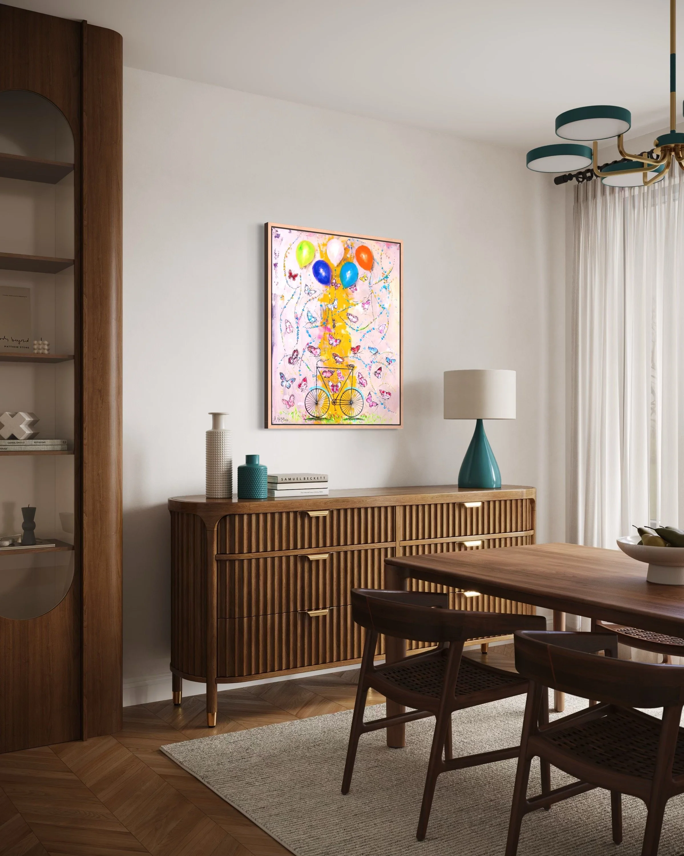 Modern dining room with wooden sideboard, framed colorful artwork, table, and chairs, decorated with a lamp, vases, and a bowl of fruit.