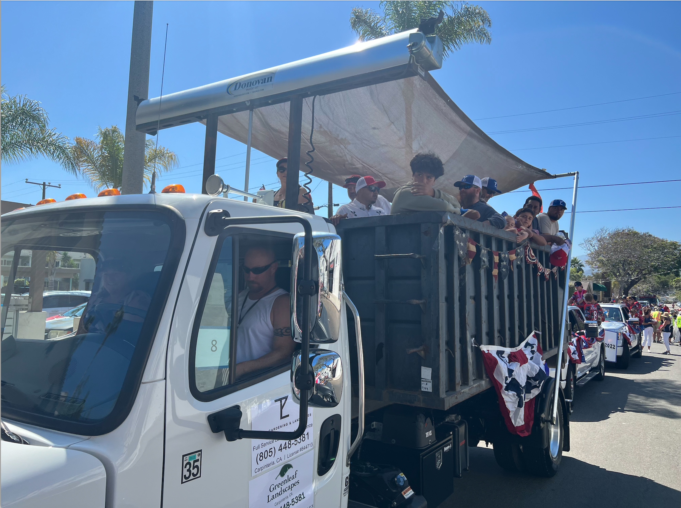 Landscaping company heavily involved in community activity participates in Fourth of July parade, Rods n Roses, Carpinteria California, Small town Southern California independence day parade. Greenleaf landscapes, Carpinteria, Santa Barbara County.