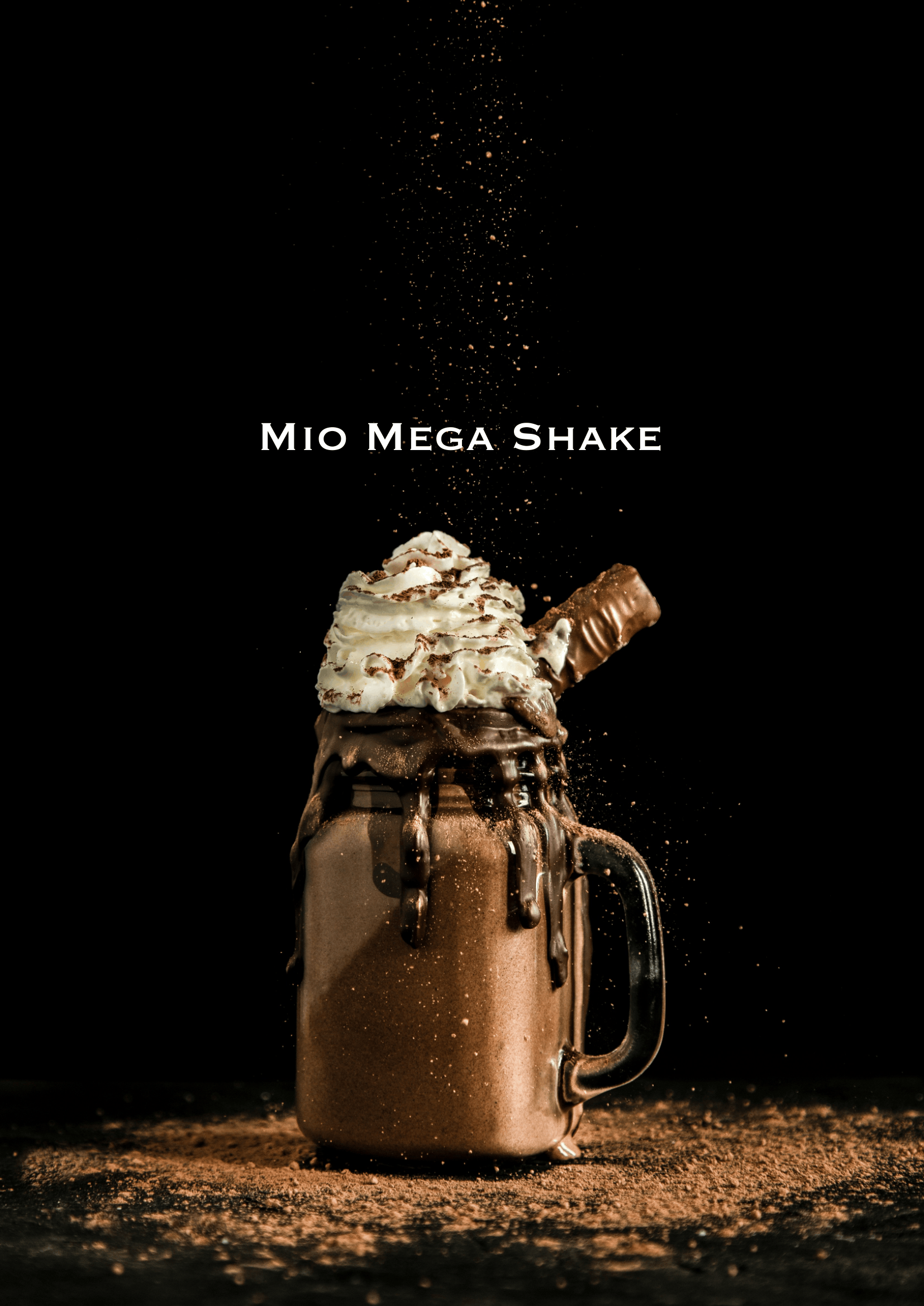A large mug filled with a chocolate shake topped with whipped cream, chocolate syrup, and a chocolate wafer, with cocoa powder sprinkled on top and around the base, set against a black background.