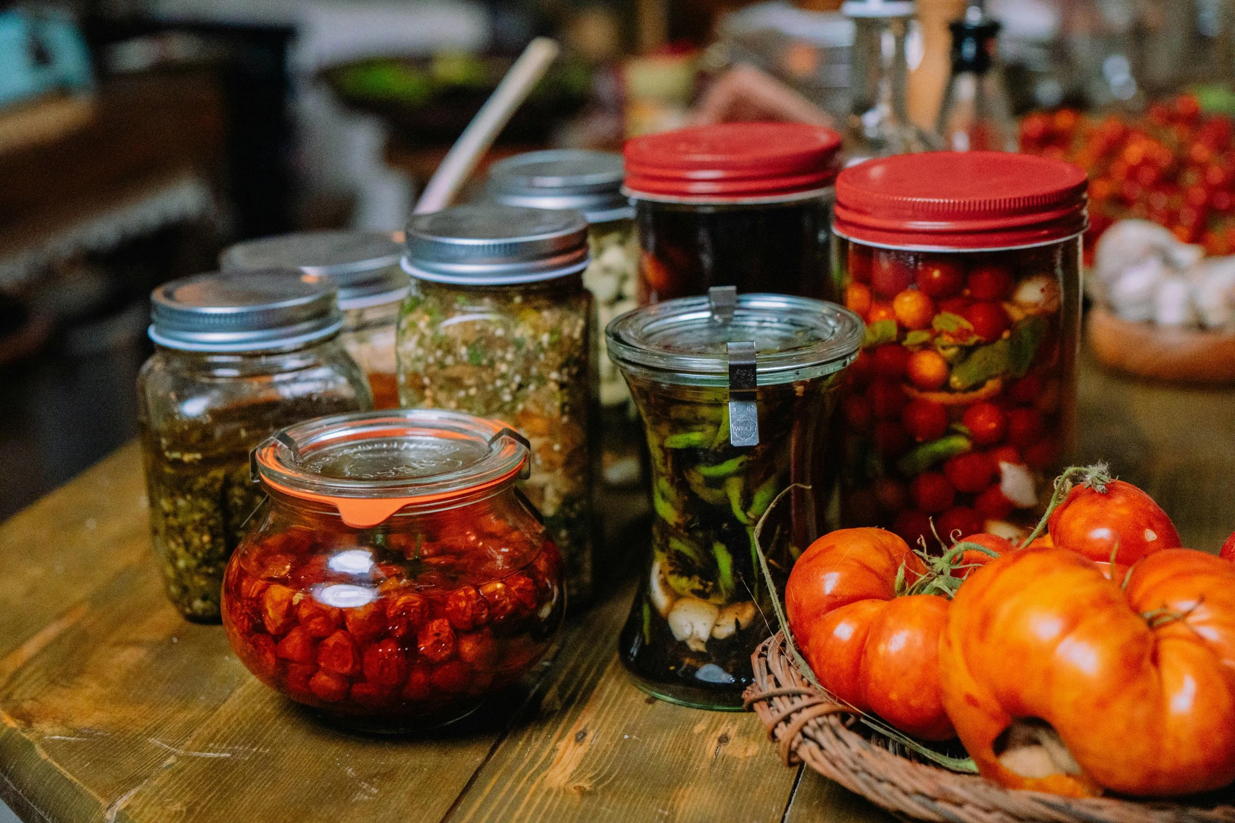 Preserved foods stored in crystal jars showcasing traditional home canning methods