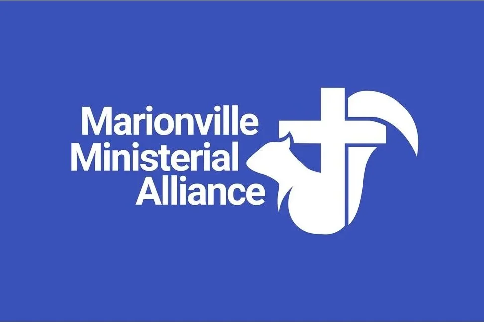 Blue background with white text and graphics featuring the words 'Marionville Ministerial Alliance.' A white cross overlays a silhouette of a cow and a wolf or dog head, symbolizing community and faith.