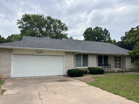 Single-story house roofed by Patrick and sons. 