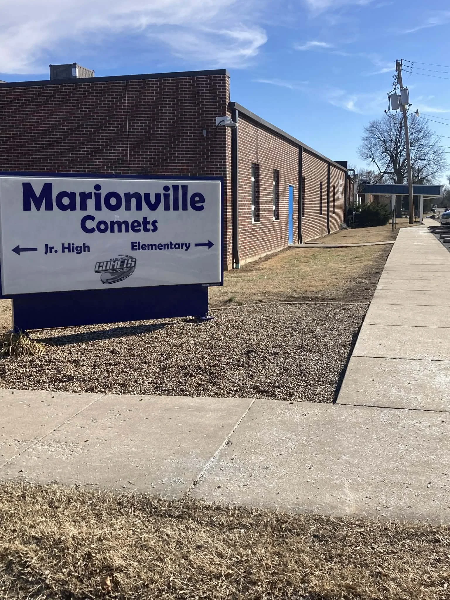 Sign indicating Marionville Comets school with directions pointing to Jr. High and Elementary.