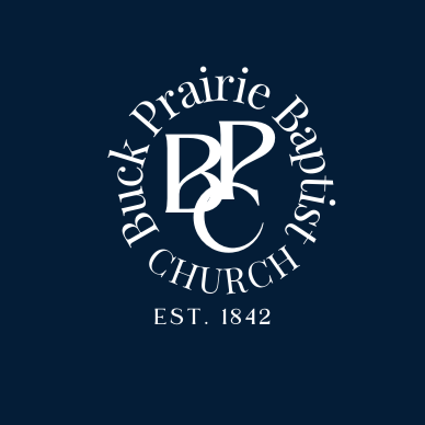 Logo for Buck Prairie Baptist Church with the text 'Est. 1842' and a monogram 'BP' at the center, all on a dark blue background.