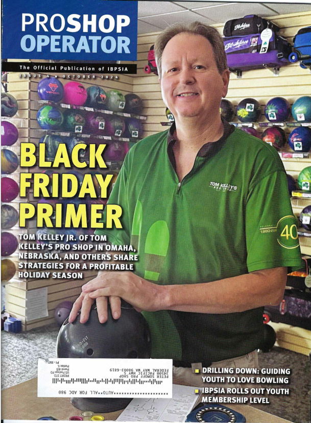Cover of ProShop Operator magazine featuring Tom Kelley Jr. from Tom Kelley's Pro Shop in Omaha, Nebraska, standing in a sports store surrounded by bowling balls and equipment.