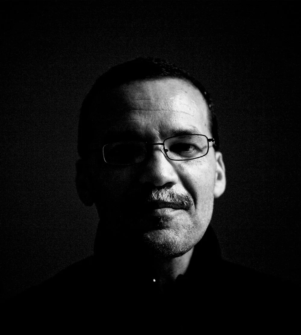 Black and white portrait of Carlos Runcie Tanaka.