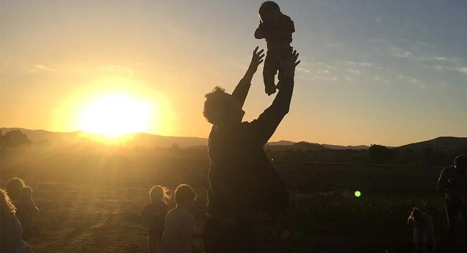 Freeman tosses his son Jamison into the air as the sun sets behind the Capay hills that surround our farm and the cousins run around picking carrots for dinner. Raising a family on the farm certainly has its beautiful moments.