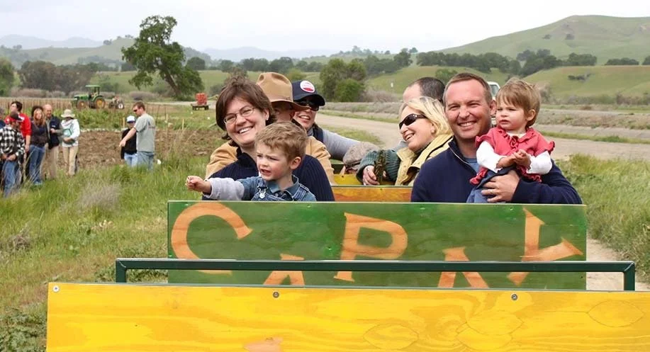 Having the community out to our farm is so important to us. Our mission is to connect people with the farmers and the land that grows their food by offering farm tours and events every Spring through Fall. Noah, Camille and two of their kids Jonah an
