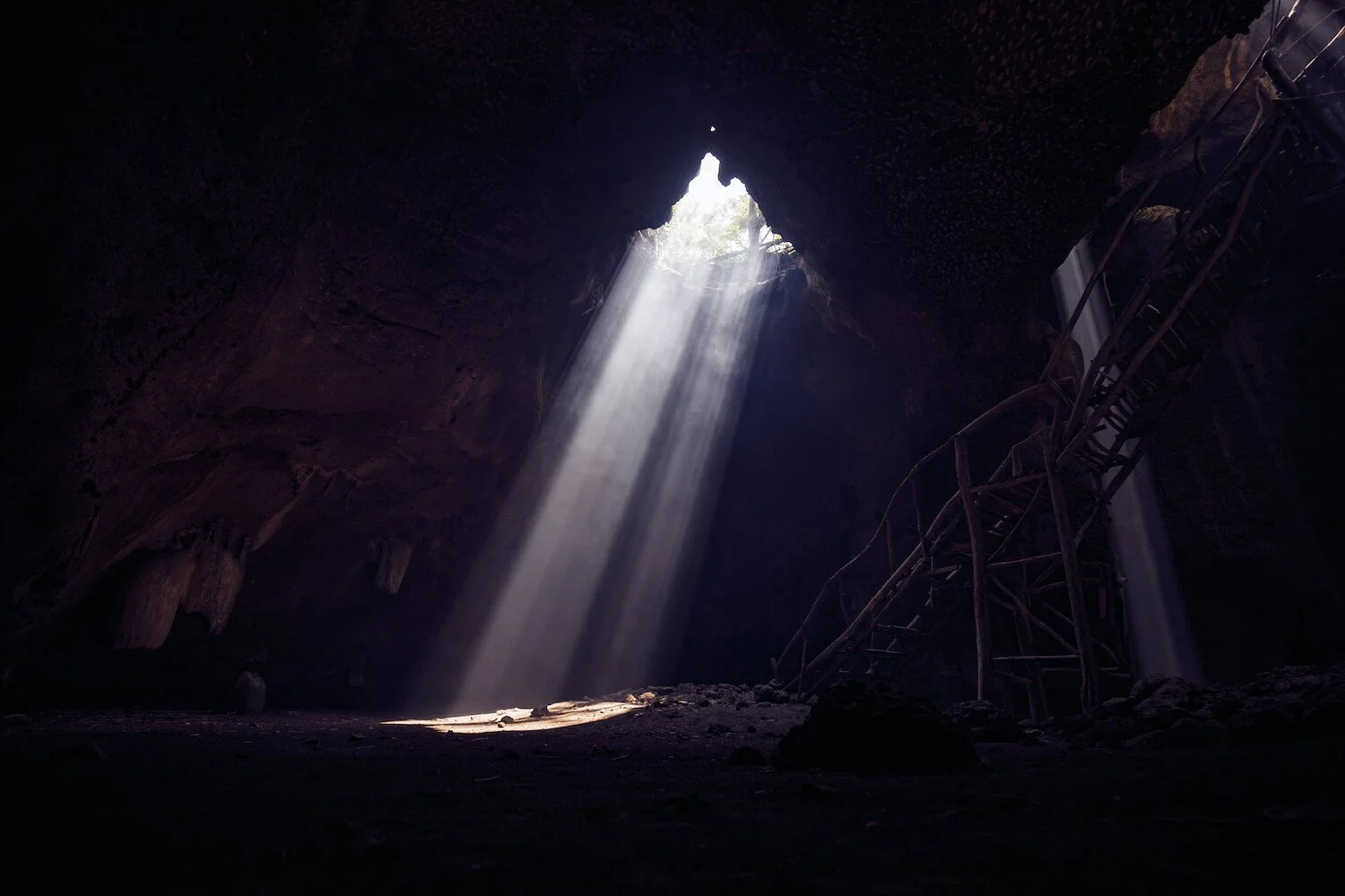 Light shining through a cave representing hope and healing after religious trauma