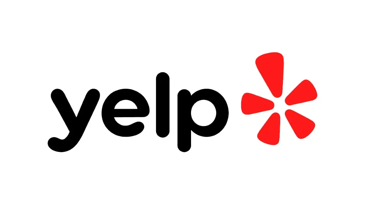Yelp logo with black text and a red asterisk-like symbol