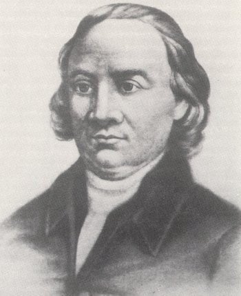 A black-and-white portrait of a man with shoulder-length hair, wearing a high-collared coat and shirt.