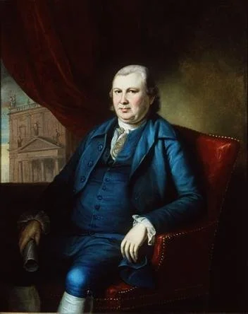 Portrait of a historical man in 18th-century attire seated in a chair, holding a rolled paper, with a classical building in the background.