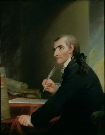 A historical portrait of a man with long hair tied back, sitting at a desk with papers and a quill pen, wearing dark clothing.