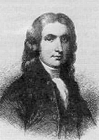 A black and white portrait of a man with long, wavy hair, wearing a dark coat over a white shirt.