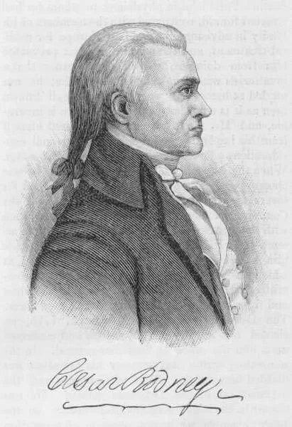 A black-and-white engraving of a man in profile, wearing 18th-century attire, with a high-collared shirt, waistcoat, and coat. The man has long hair tied back and is looking to the right. There is a signature that reads "Oscar Barlow" below the image.