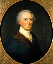 Portrait of a man with gray hair, wearing historical clothing, painted in an oval frame.