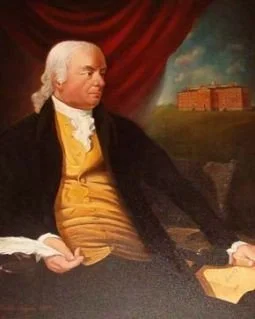 Portrait of George Washington seated outdoors with a red curtain and a building in the background.