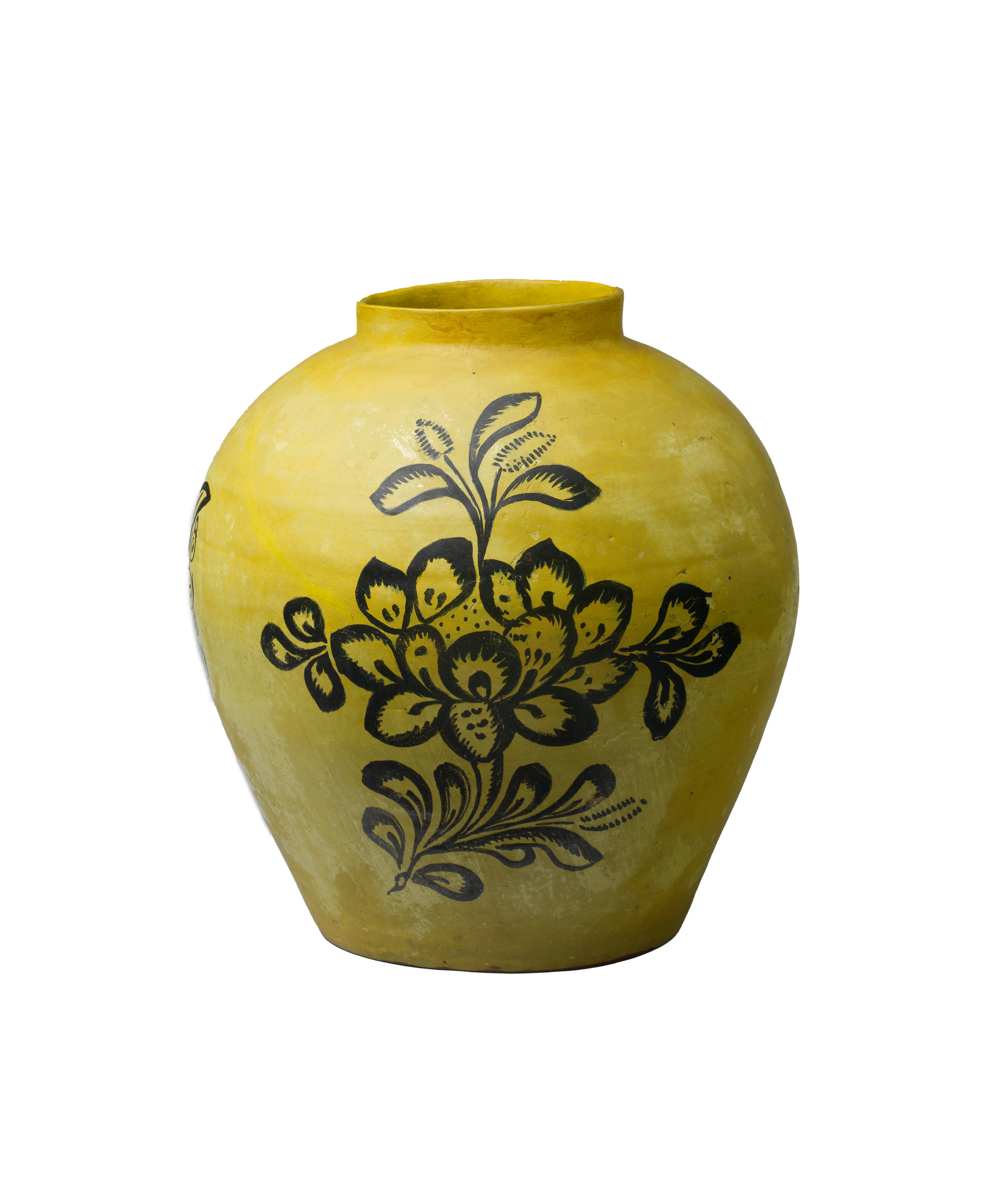 Yellow ceramic vase with black floral designs.