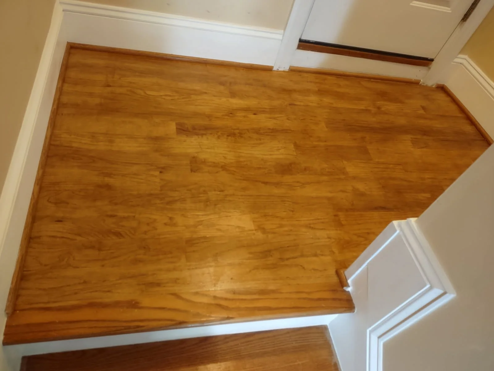 Renovated stairwell including custom molding.