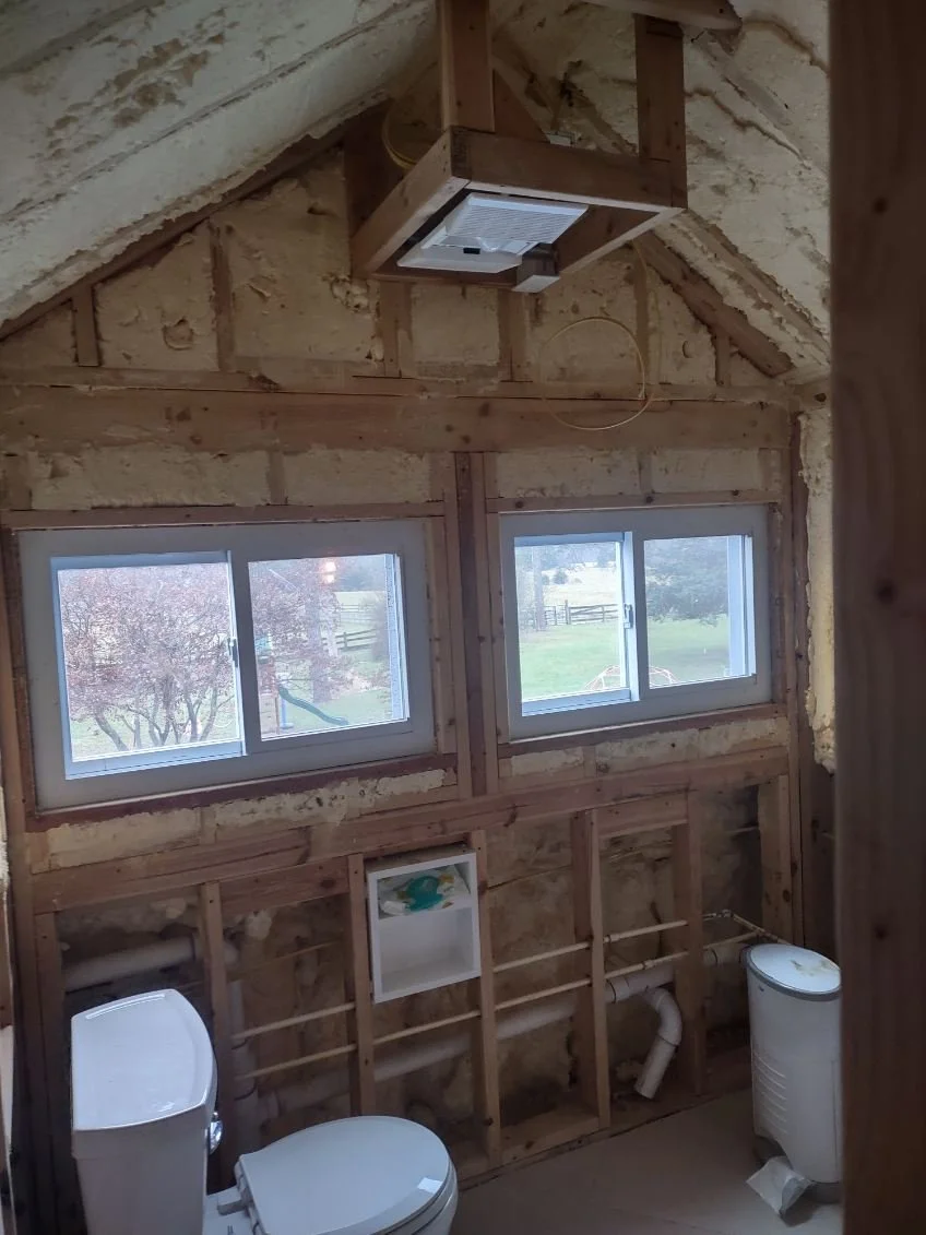Custom windows and bathroom installed in new dormer interior space.