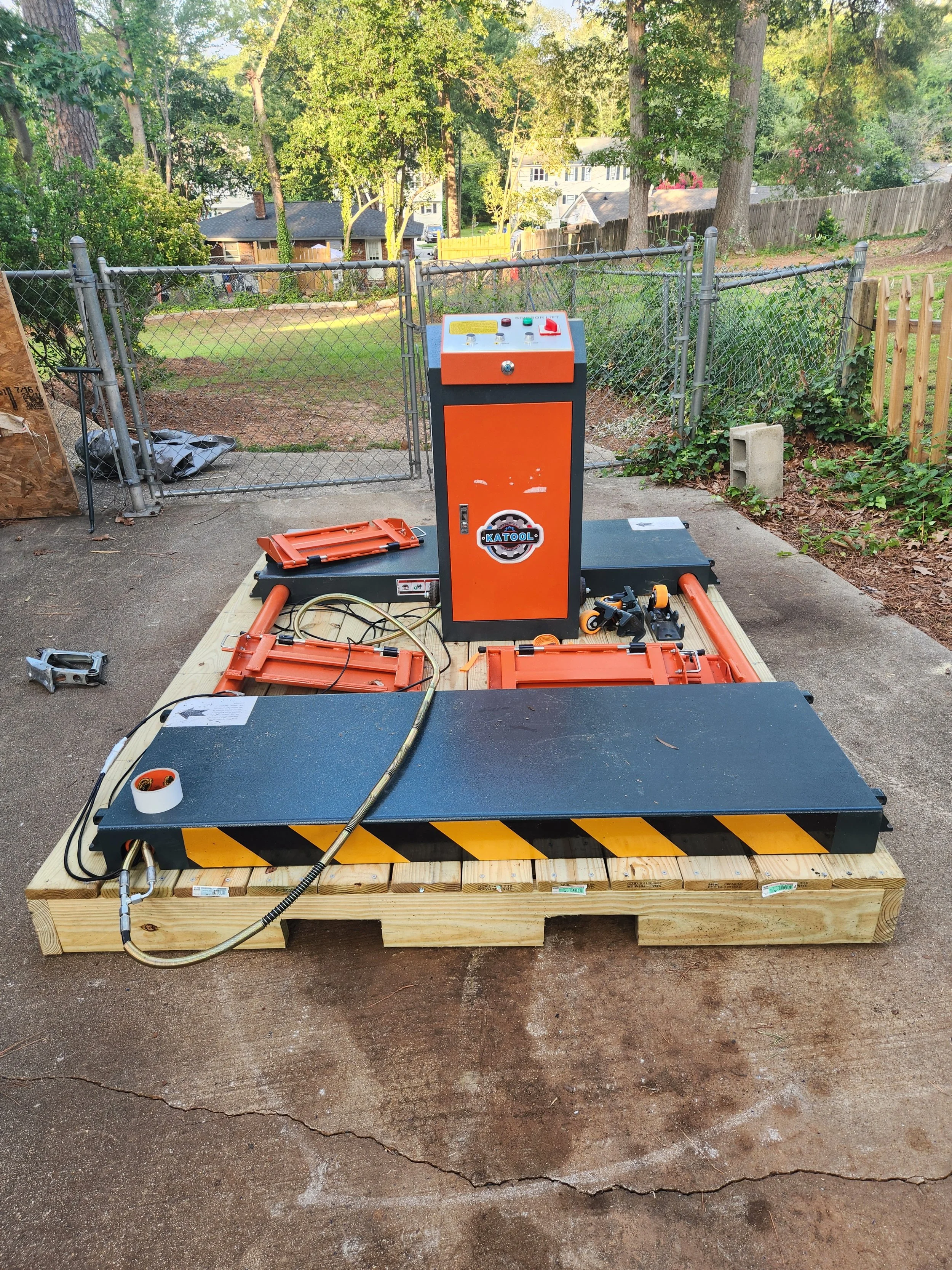 After days of figuring out how to get this extremely heavy "mobile" lift onto the pallet, we were successful. I don't know how we'll ever get it off, but one step at a time...