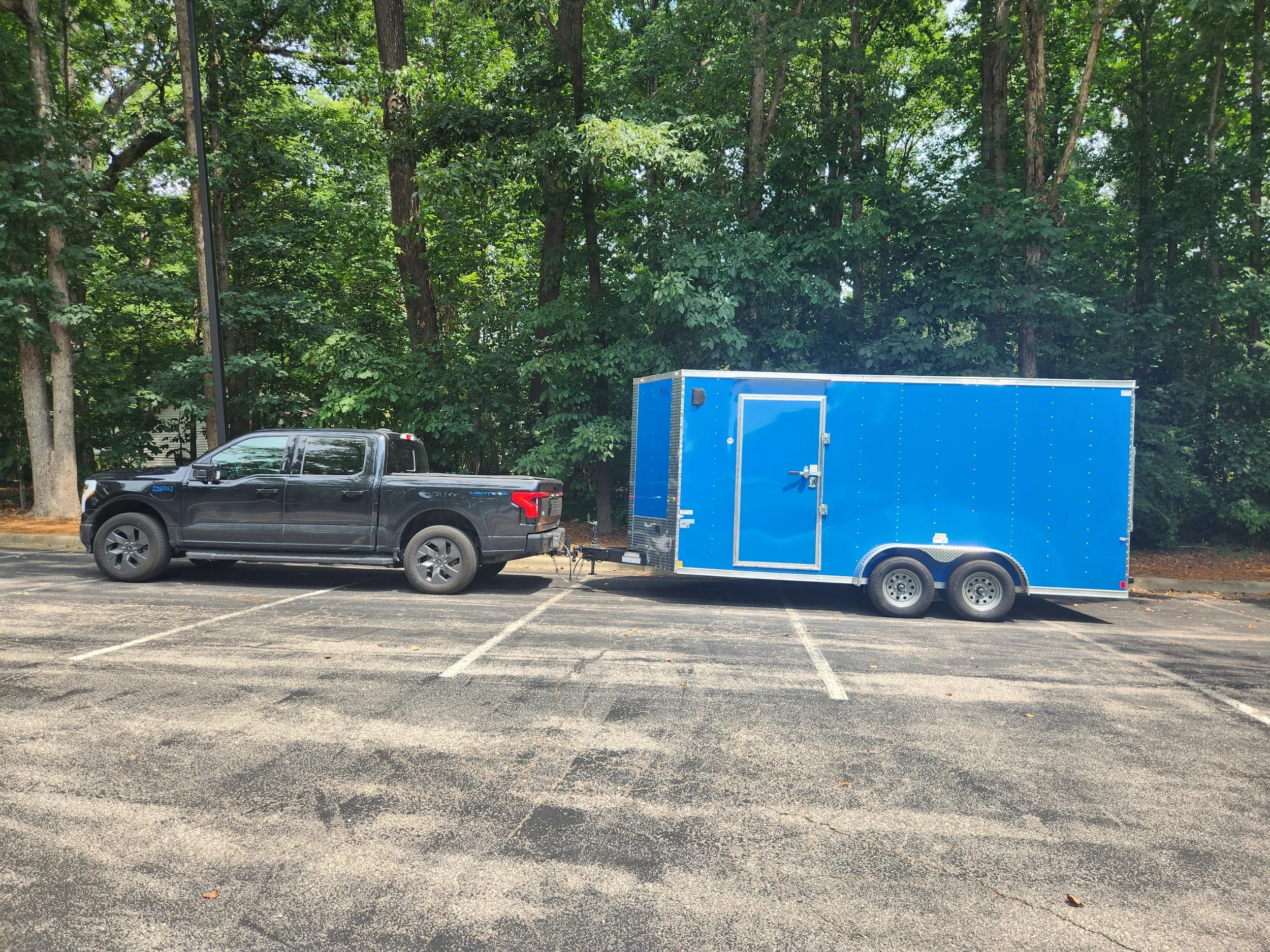 16 foot trailer hauled by a 2024 Ford F150 Lightning. The truck is 100% electric and can be used to power all of the equipment and tools.