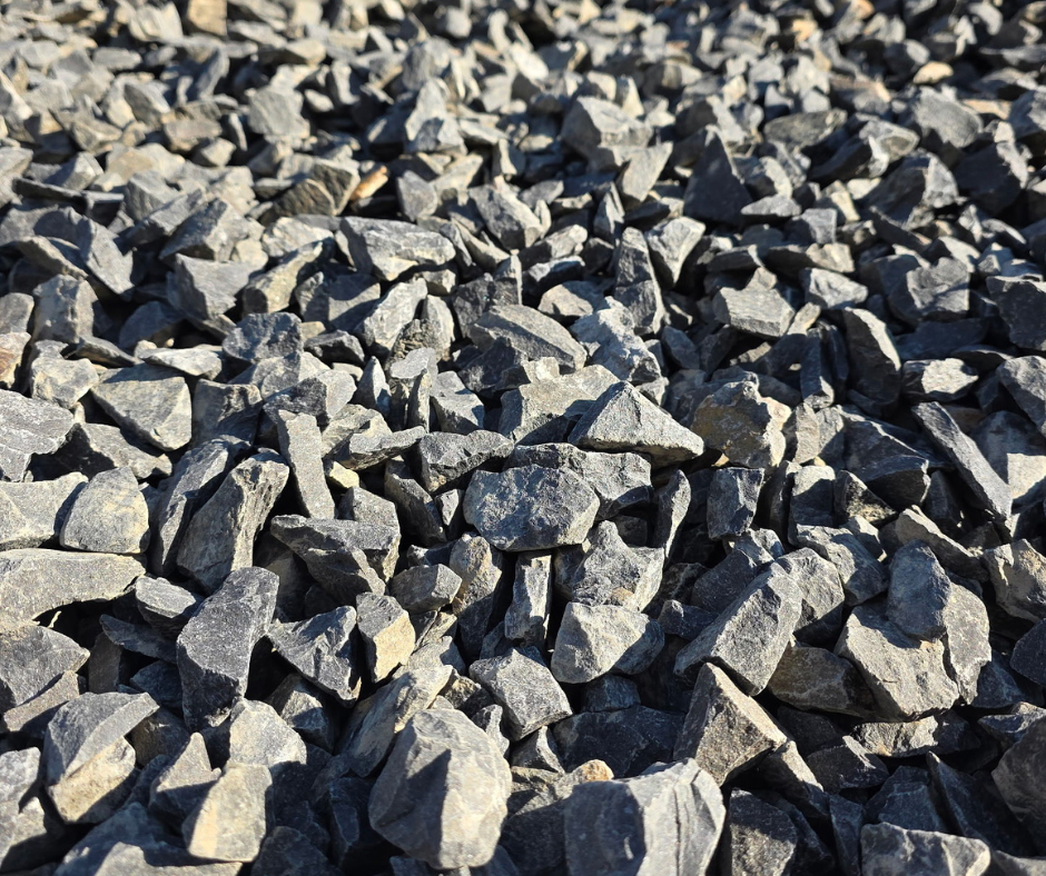 Close-up of gray gravel stones on the ground also called open rock, can be sourced from Bedrock Holdings Group's Haley Heritage quarry.