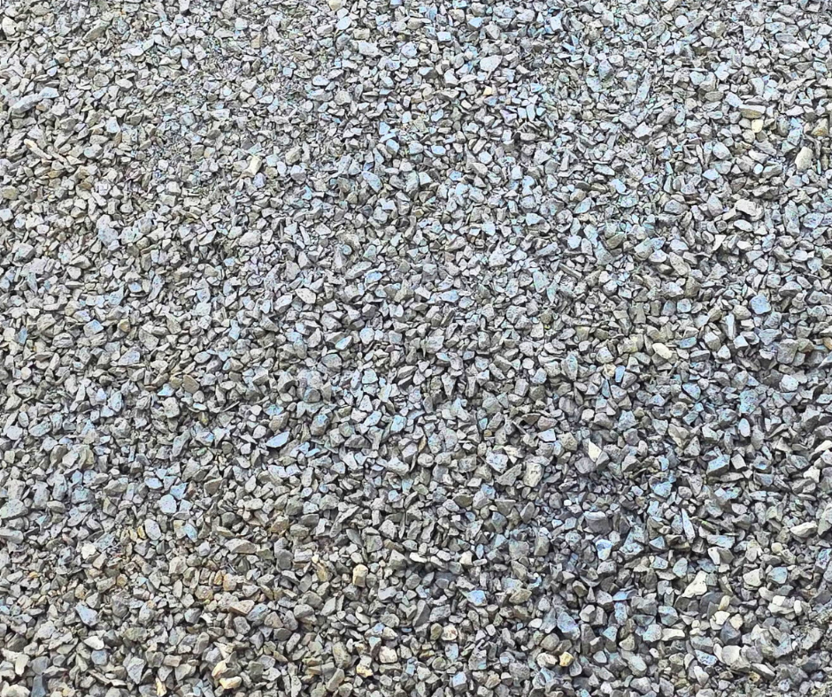 Close-up of small gray gravel stones covering the ground. This minus rock make the perfect gravel and can be found at Bedrock Holdings Group's Haley Heritage location, serving Linn County.