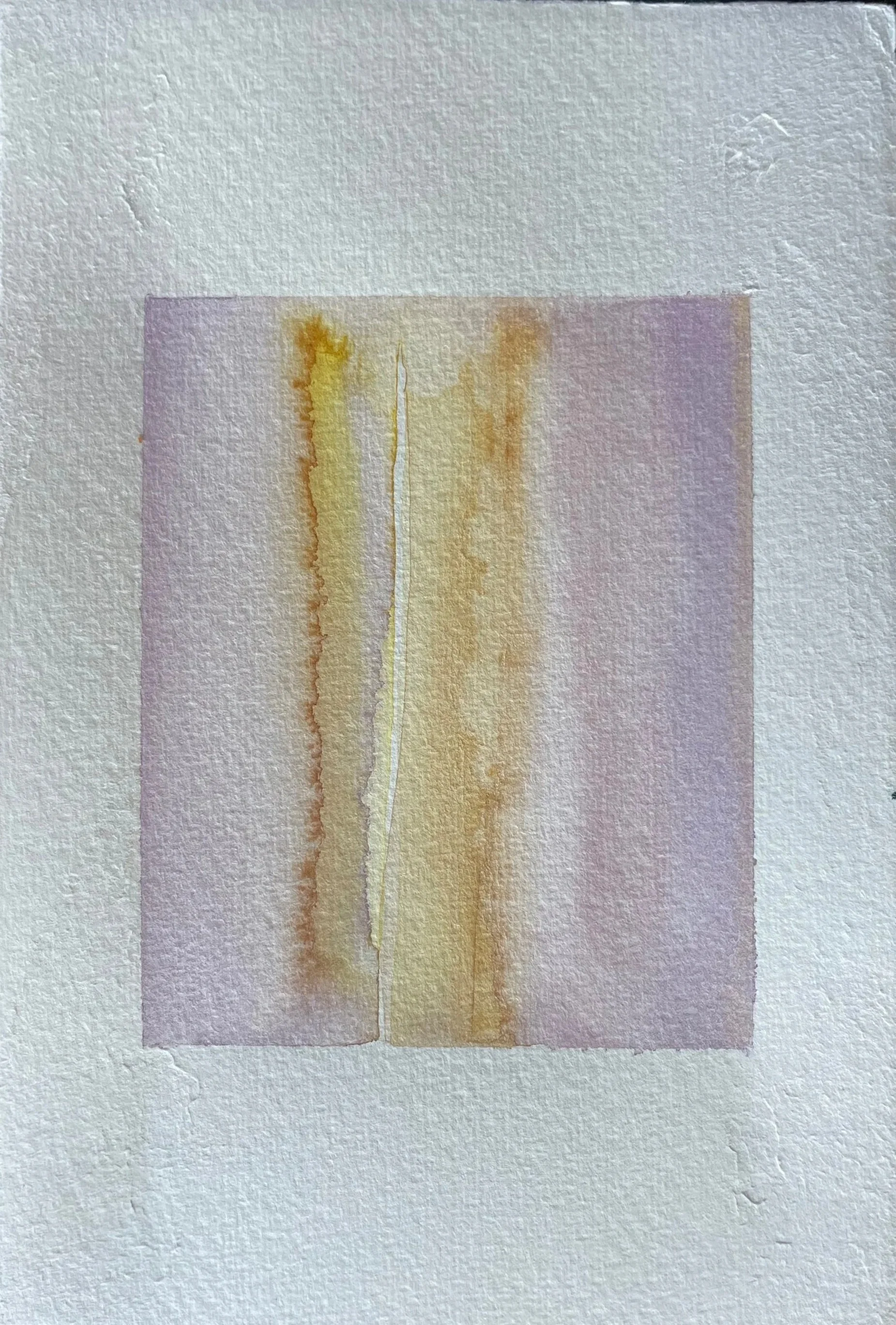 Abstract watercolor painting with vertical streaks of yellow, orange, and light purple on textured paper.