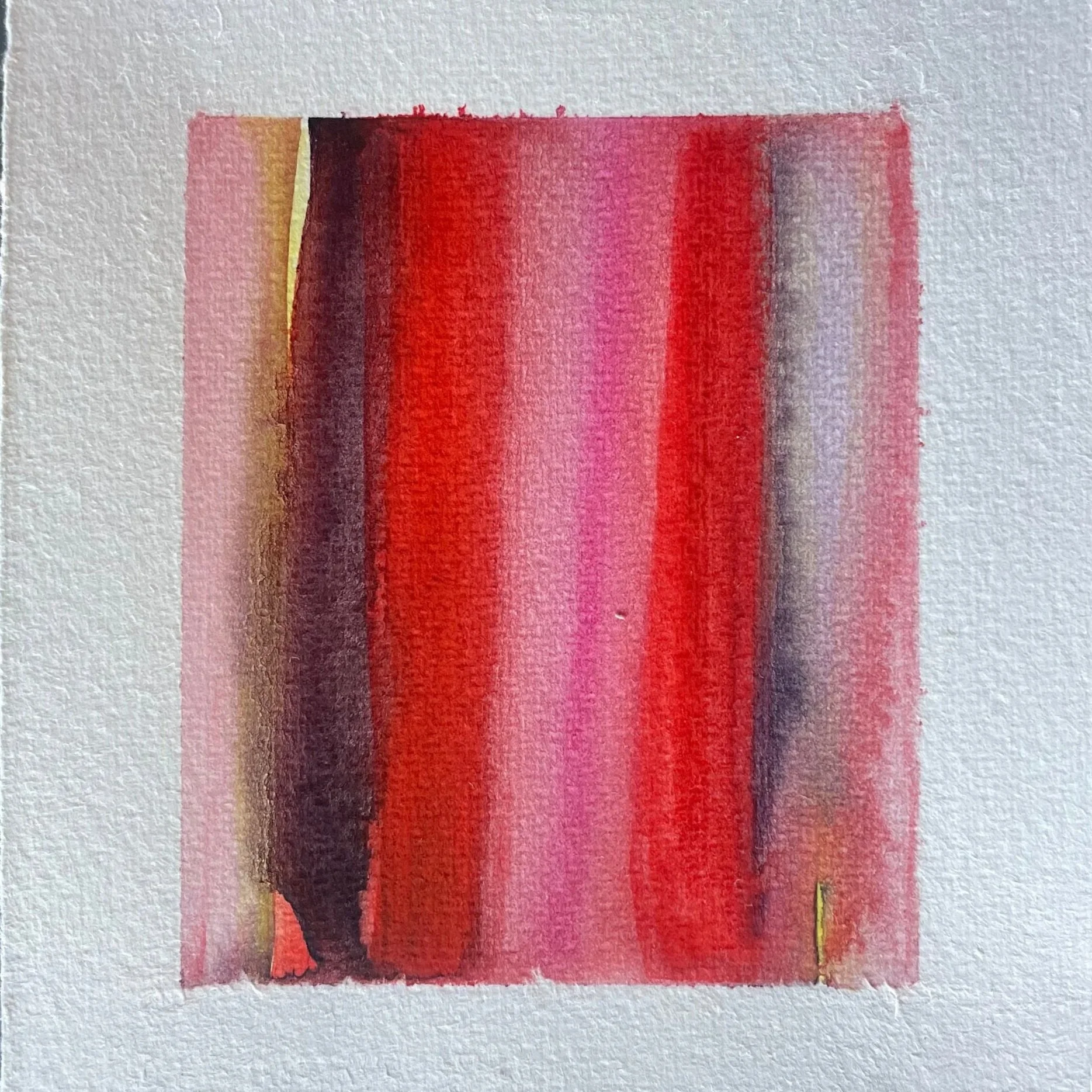 Abstract watercolor painting with vertical streaks of red, pink, black, and hints of yellow on textured paper.
