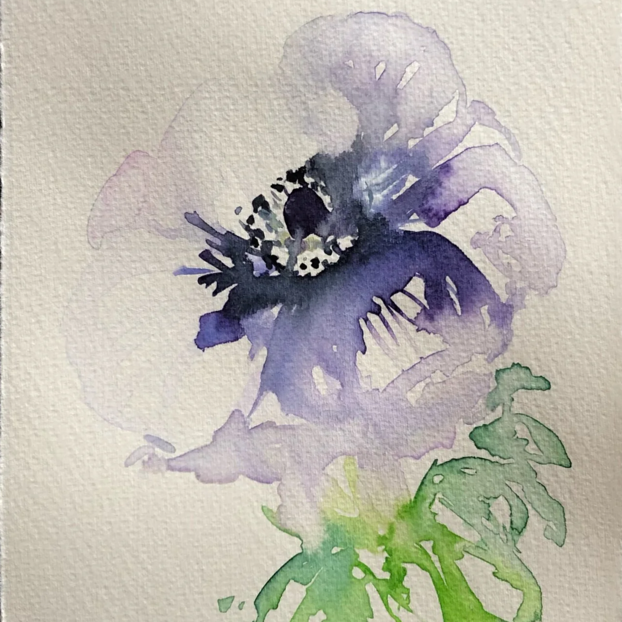 Watercolor painting of a purple flower with green leaves.