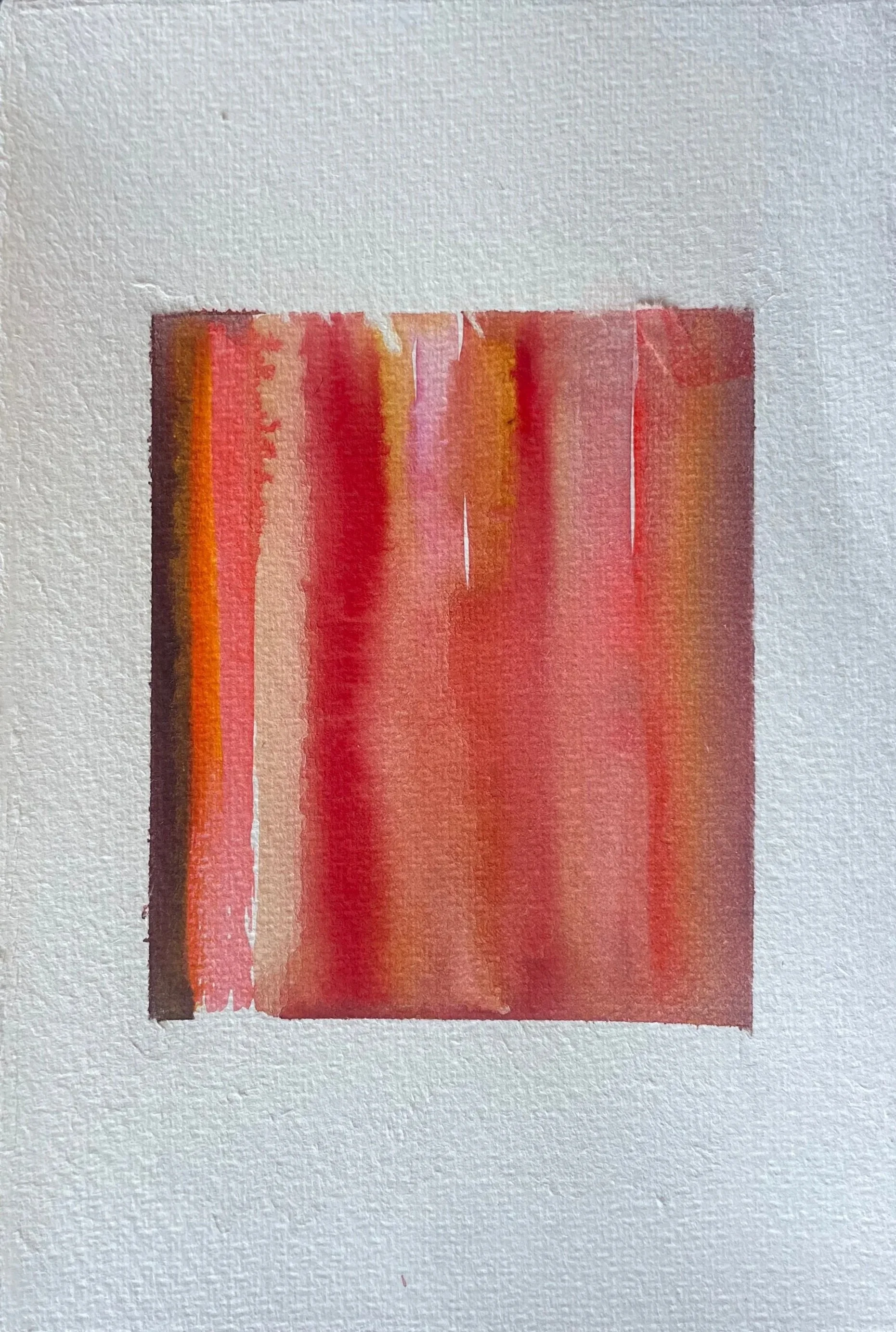 Abstract watercolor painting in shades of red, orange, and pink on textured paper.