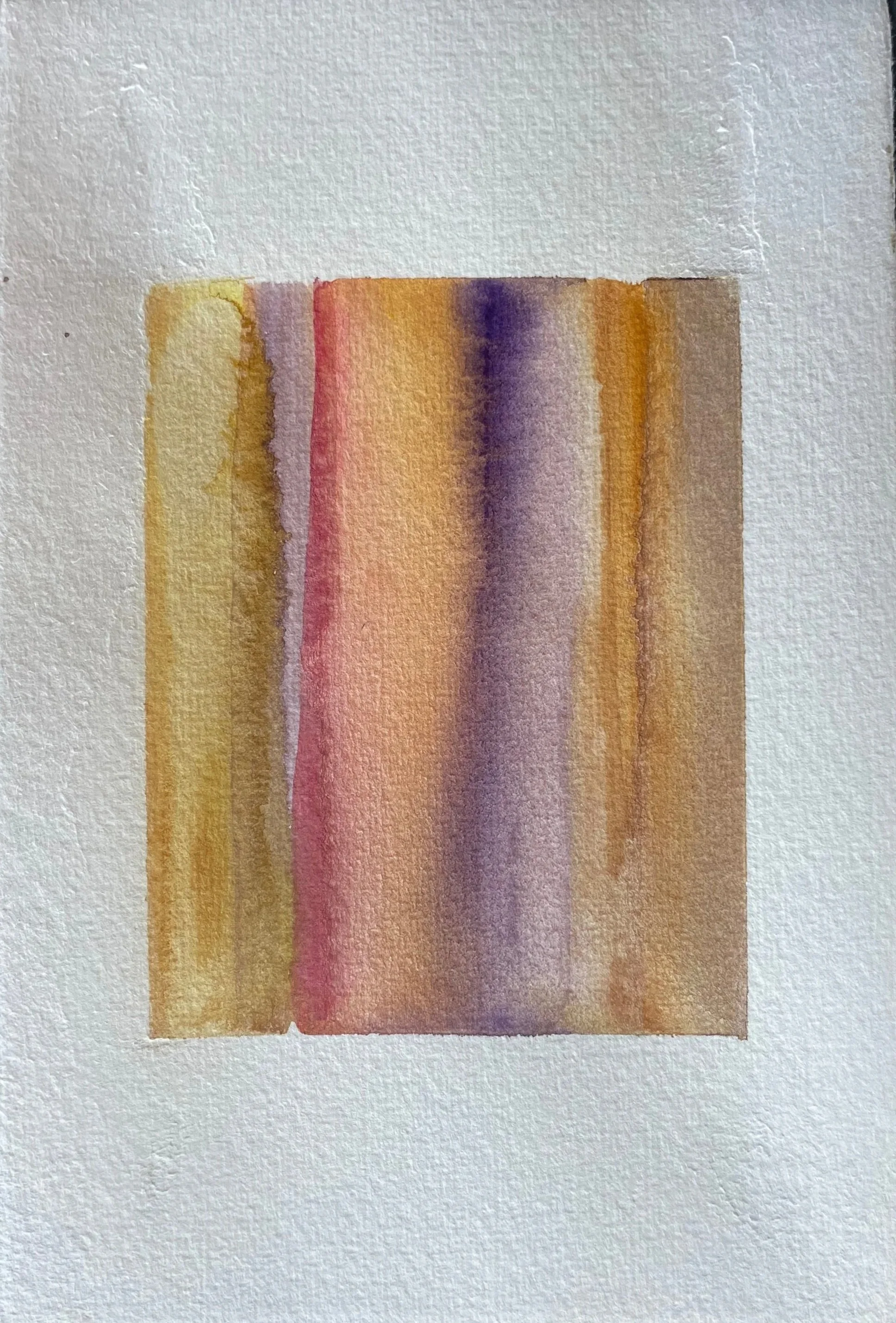 Abstract watercolor painting with vertical stripes in shades of yellow, orange, red, purple, and brown on textured paper.