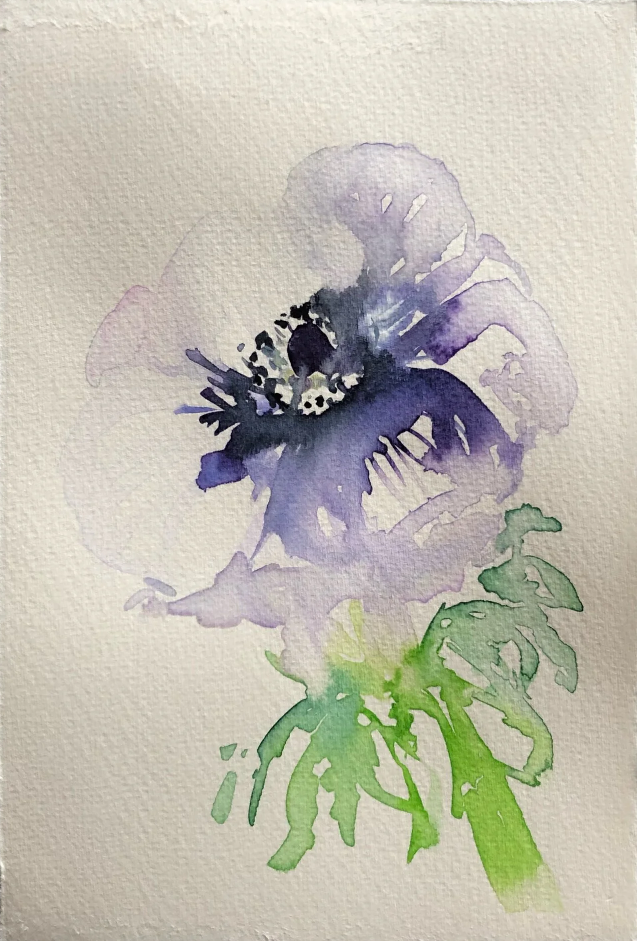 Watercolor painting of a purple and blue flower with green leaves.