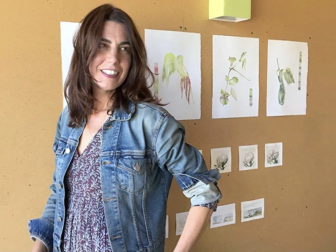 Jennifer Mobley with watercolor work.