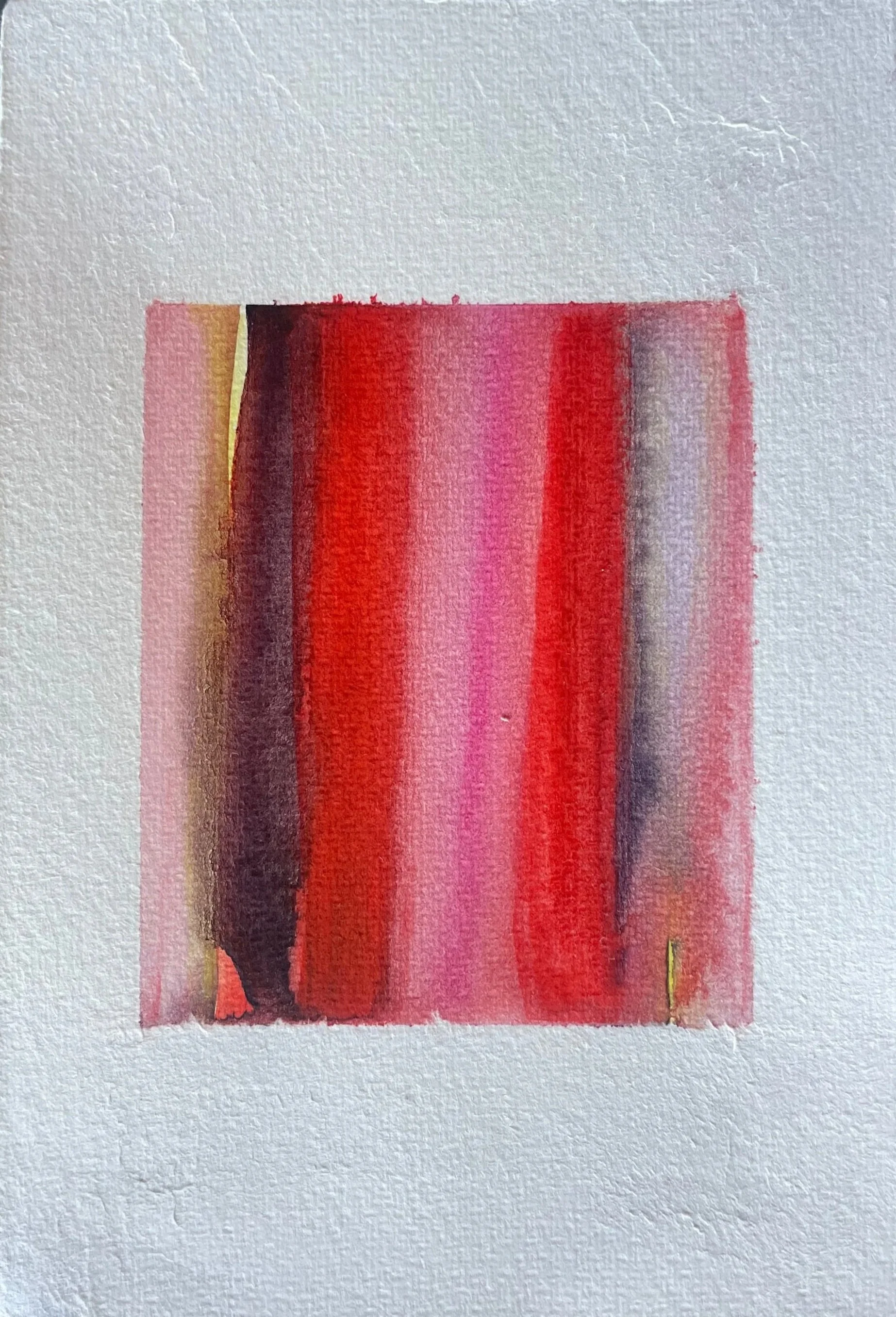 Abstract watercolor painting with vertical streaks of red, pink, black, yellow, and purple on textured white paper.