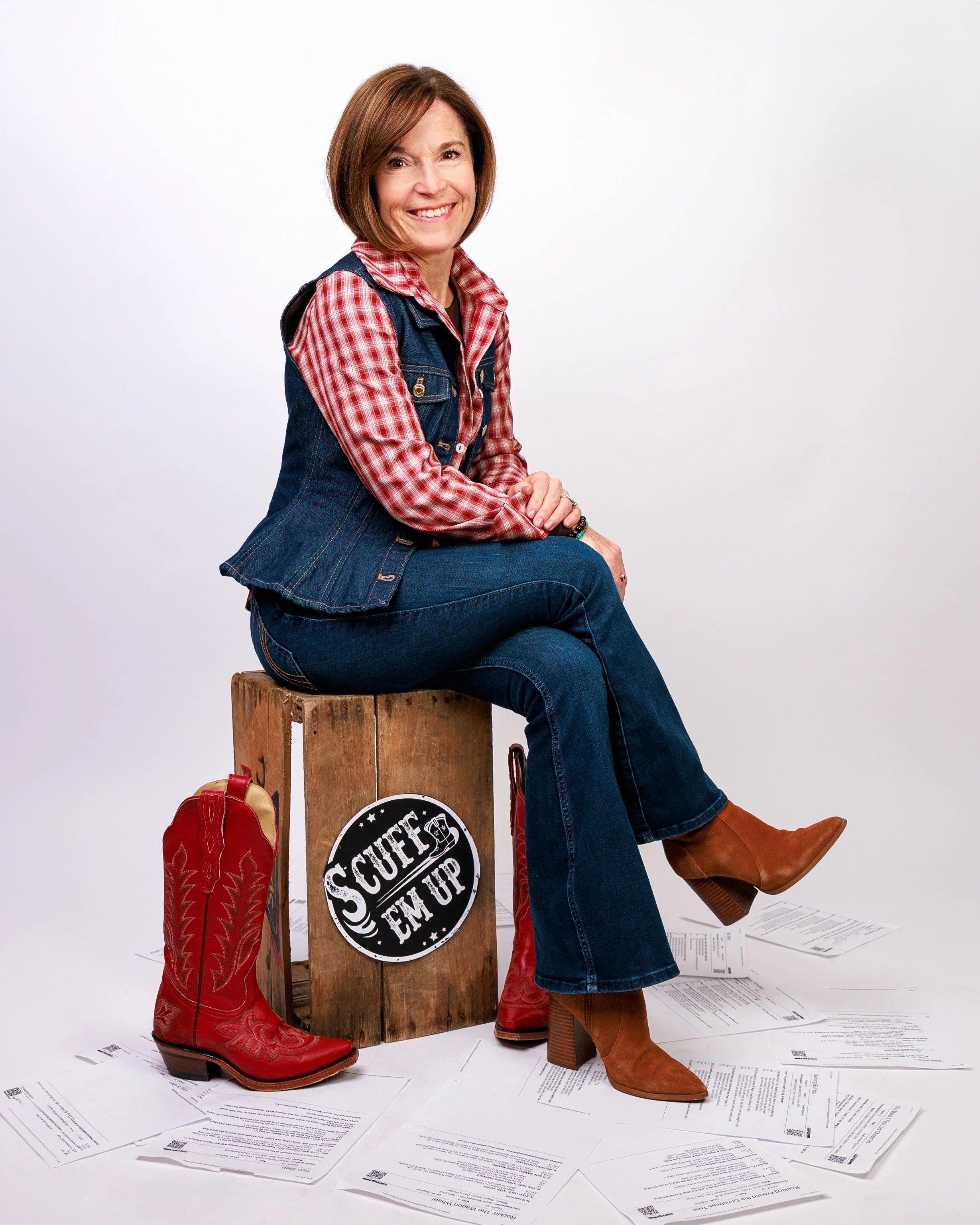 Founder Carol-Ann sitting on a crate