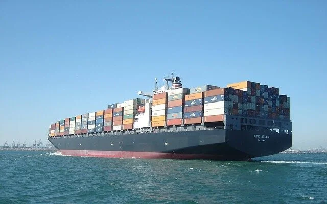 container ship heading to port