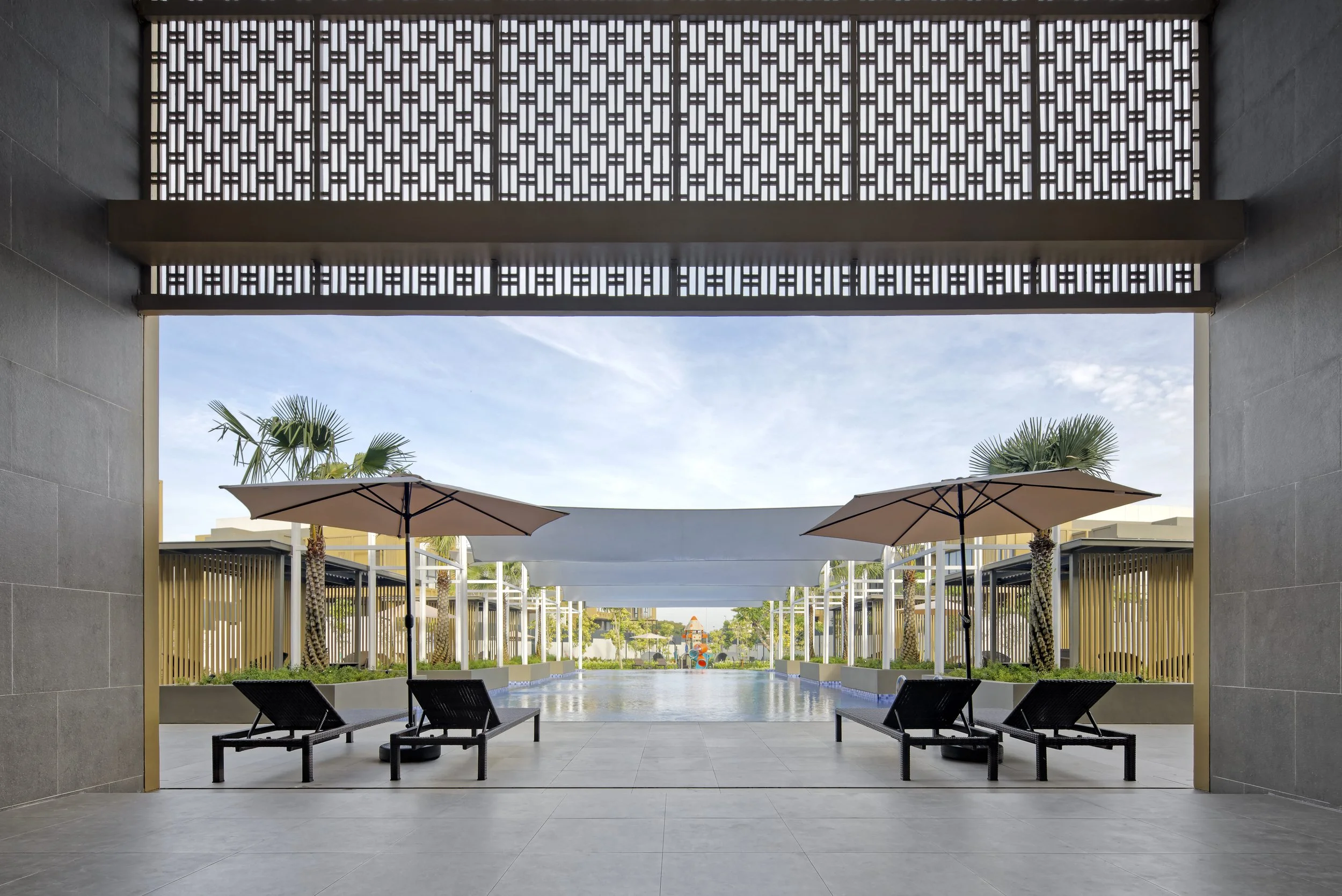 Enchante Club House poolside lounge and outdoor seating area