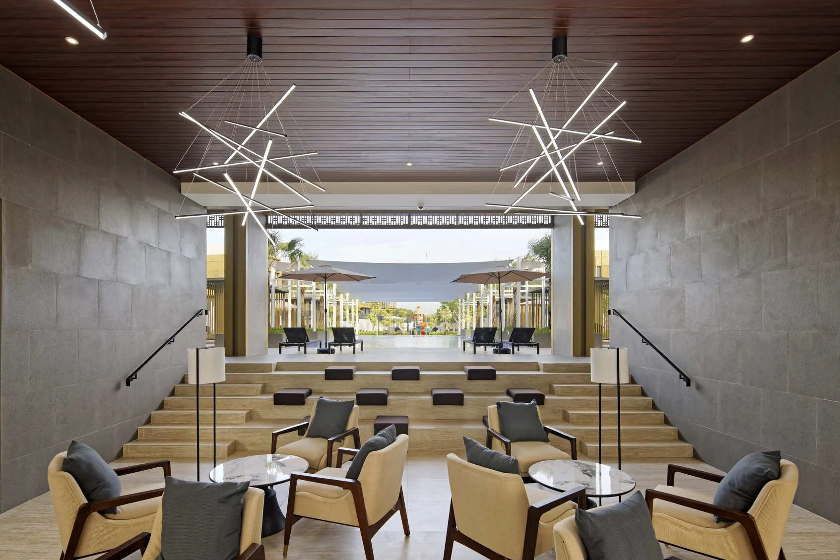 Enchante Club House poolside lounge and outdoor seating area