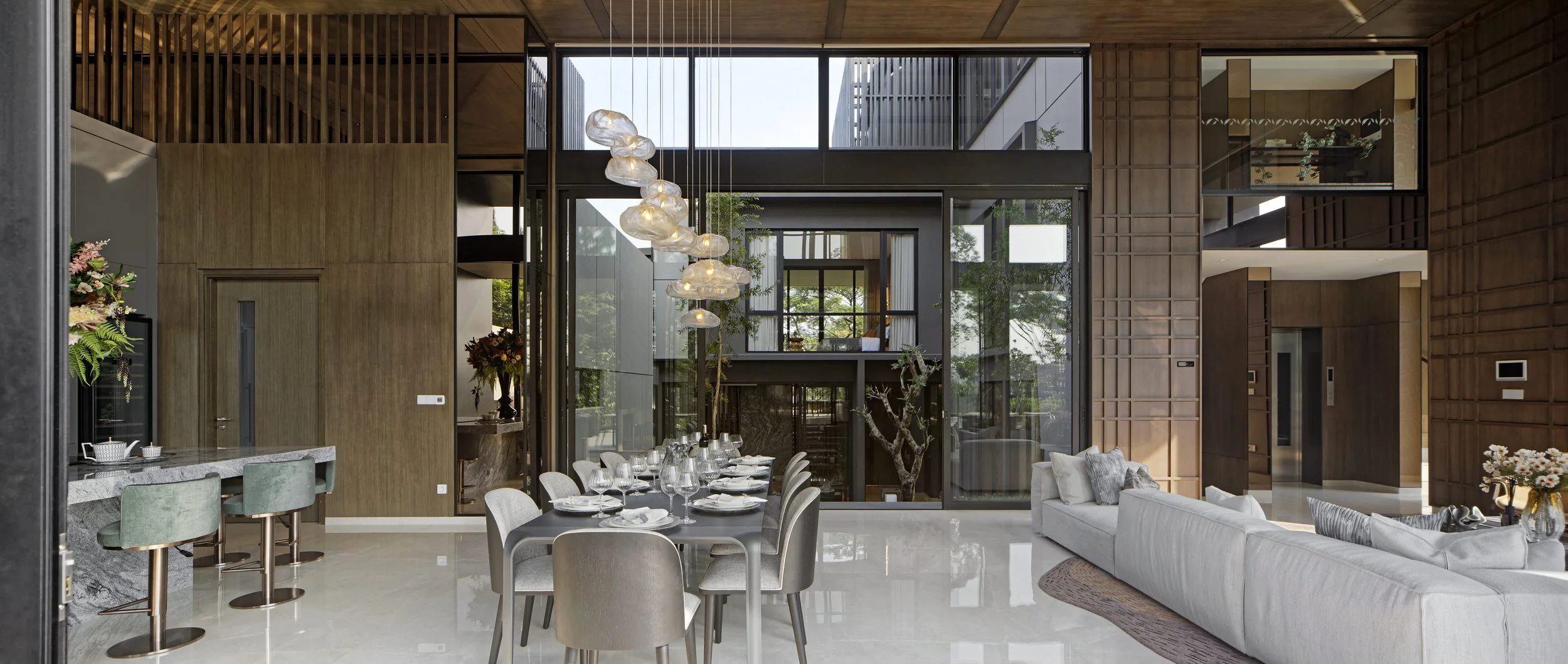 Botanic Villa interior perspective showing the living room, minibar and dining area