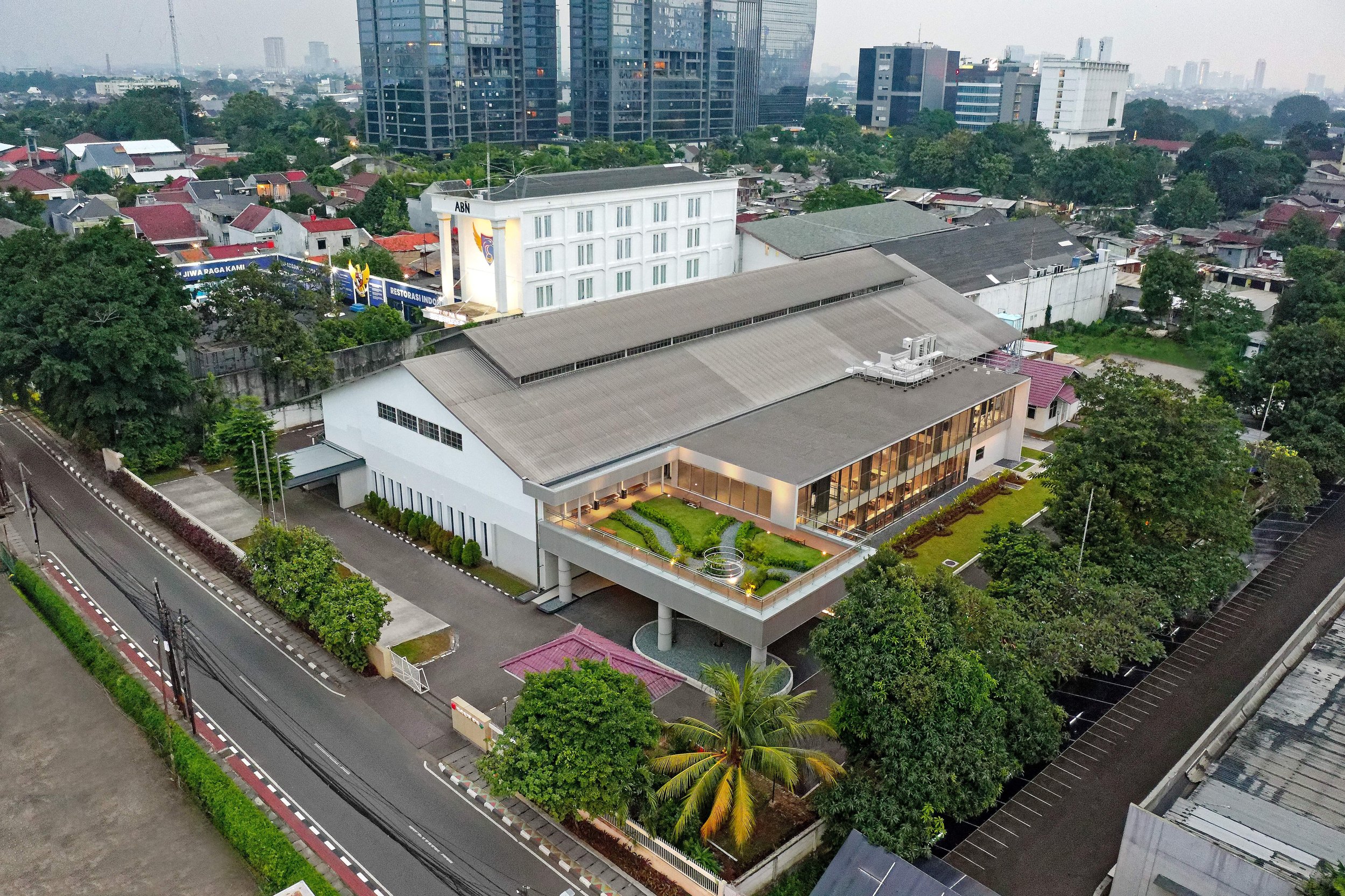 Aerial view of a contemporary building and surrounding landscape