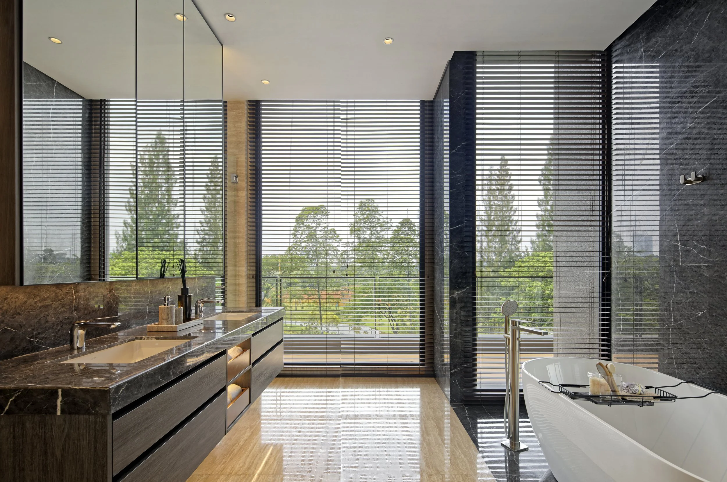 Botanic Villa master bathroom with vanity and bathtub facing the outdoor space