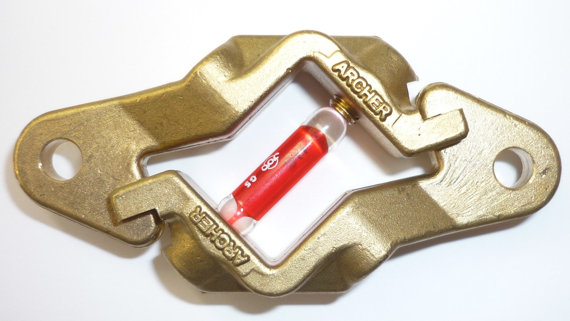 A gold-colored mechanical part with the word 'ARCHER' engraved on it, holding a small vial with red liquid labeled 'ACE 5'.