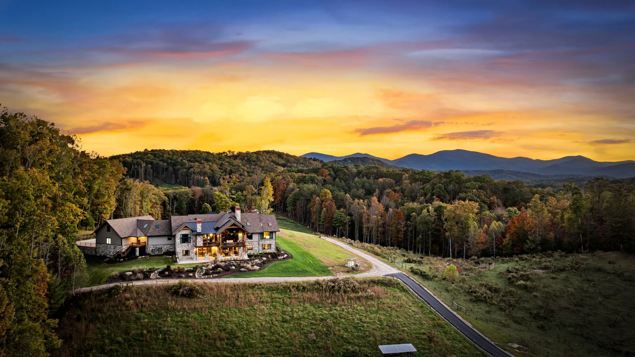 Custom mountain home exterior in North Georgia with timber beams, stone accents, and scenic mountain views
