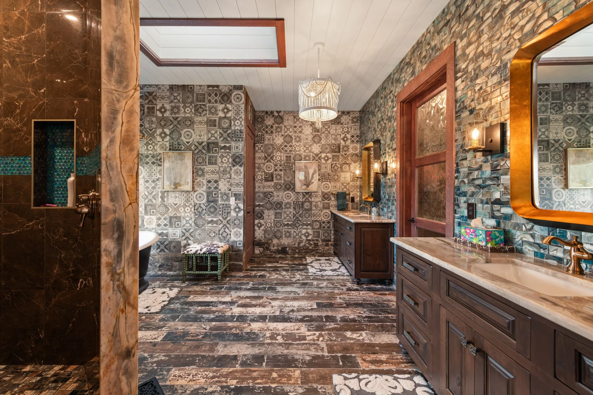 Detailed stone and tile in master bathroom 