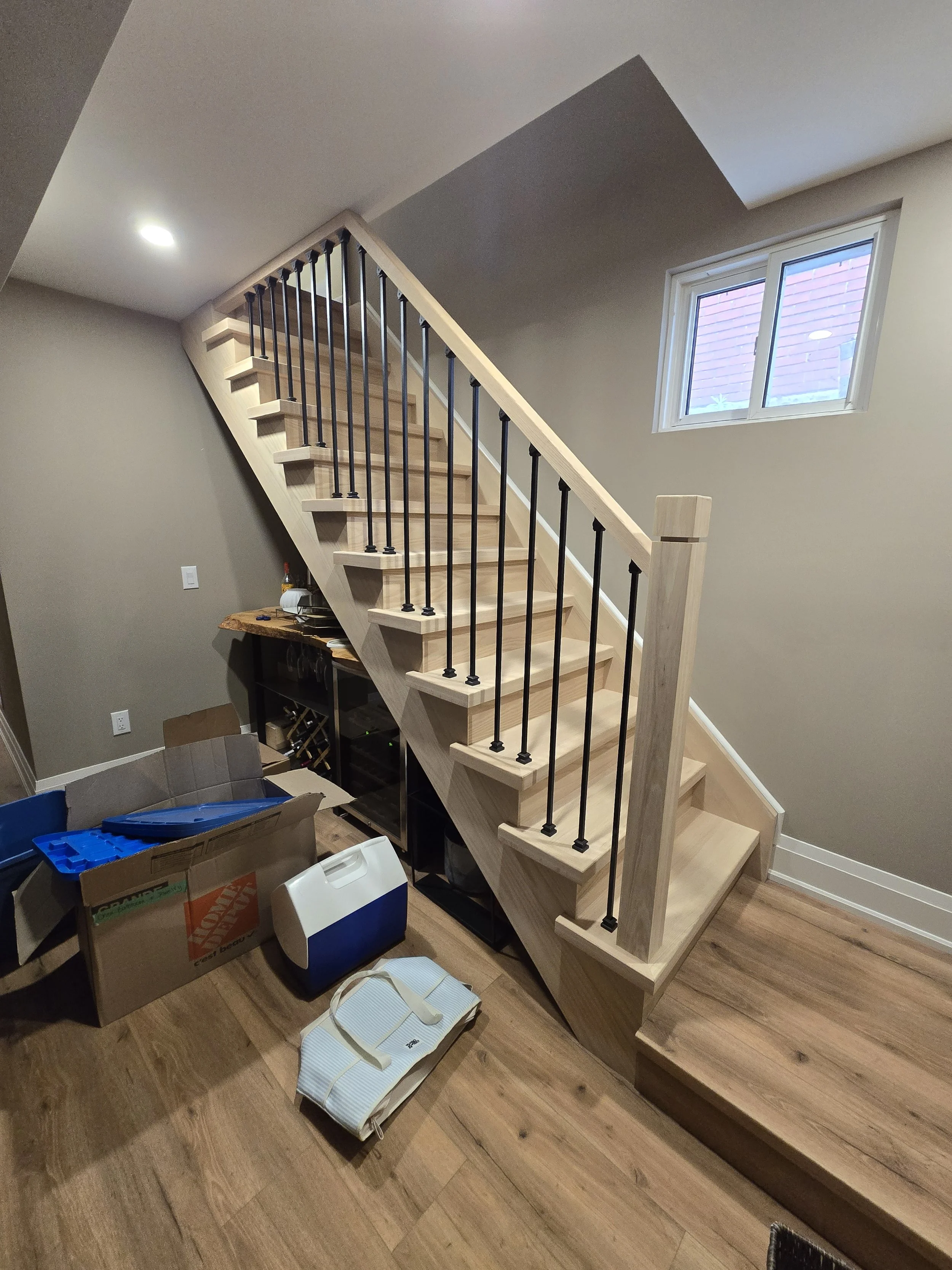 New basement steps before:  Raw oak steps installed and ready for stain
