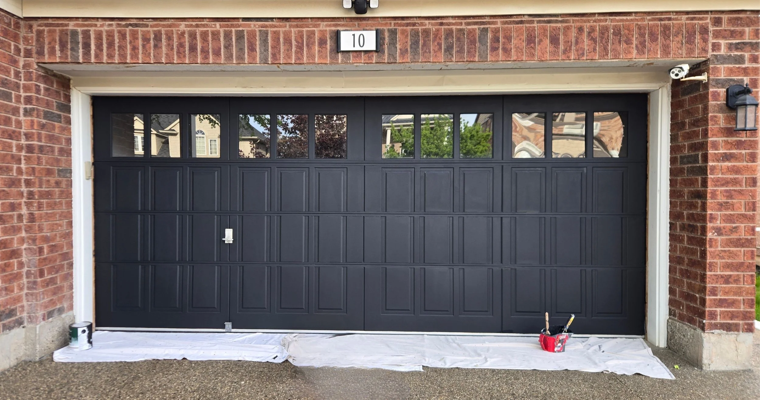 Dehavilland garage after - scraping, feathering, priming and painting (BM Black Satin 2131-10)