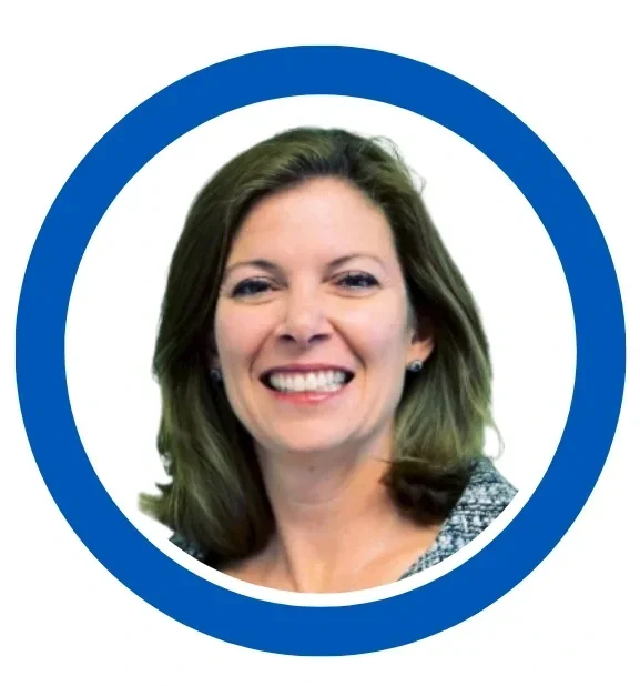 Smiling woman with shoulder-length brown hair inside a blue circle.