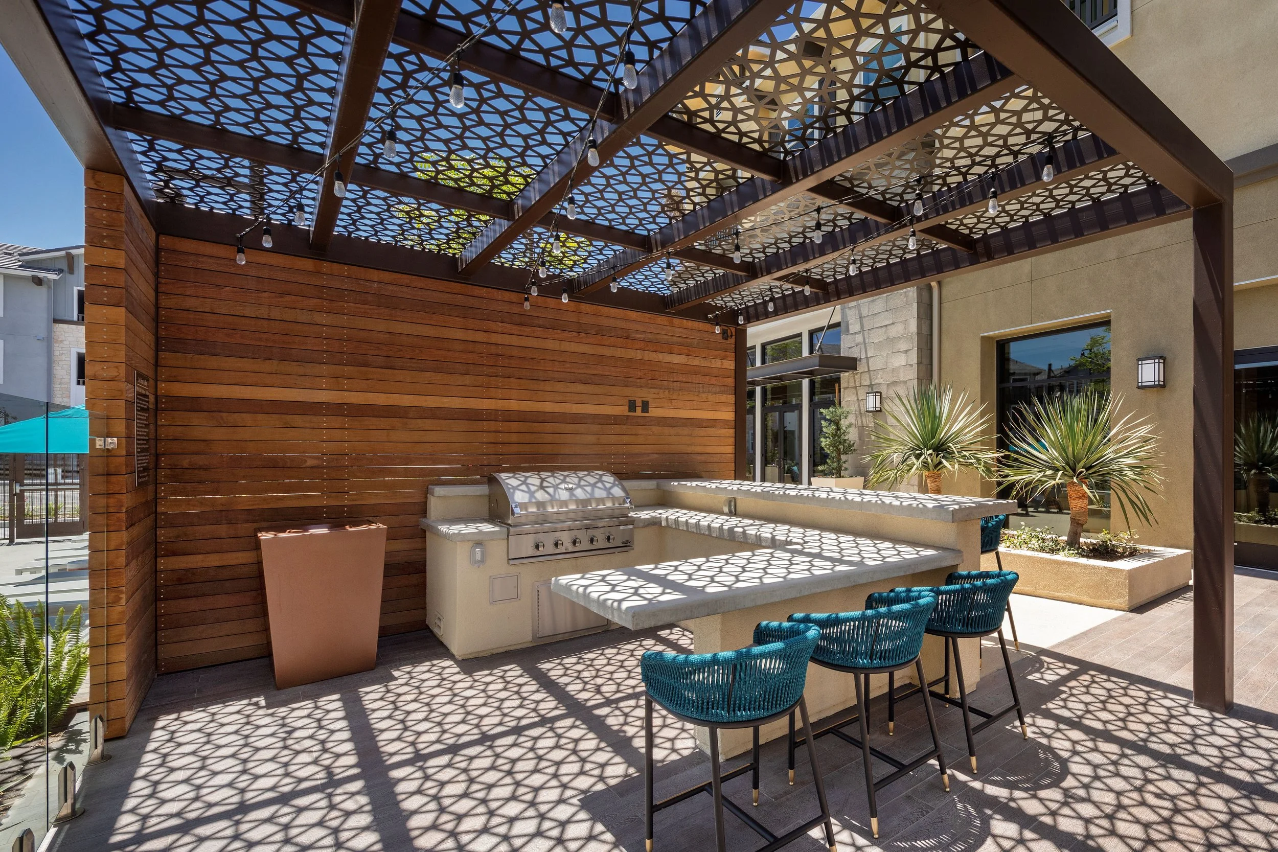 PAC STUDIO_Escaya_Multifamily_Pool Deck_BBQ Node_FF&E
